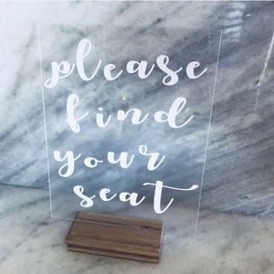 Please find your seat sign